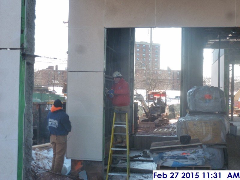 Aligning stone panels at the North Elevation